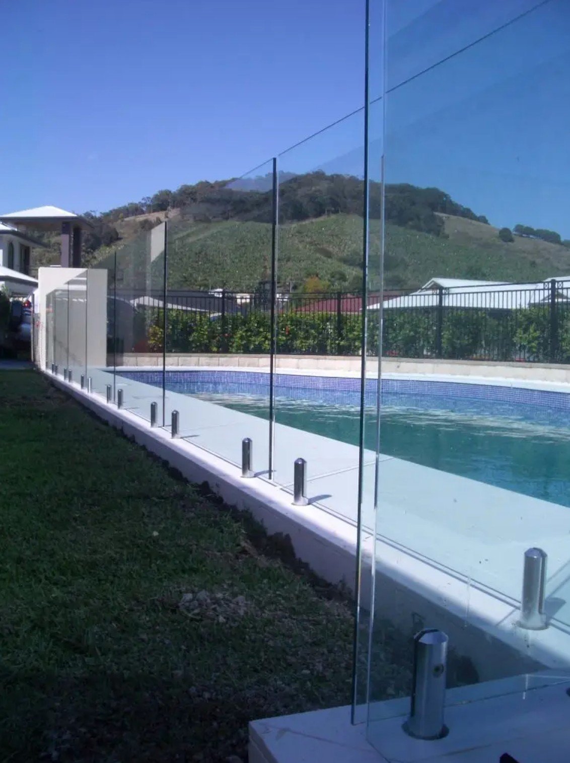 Frameless glass pool fence with stainless spigots - electrical bonding planning