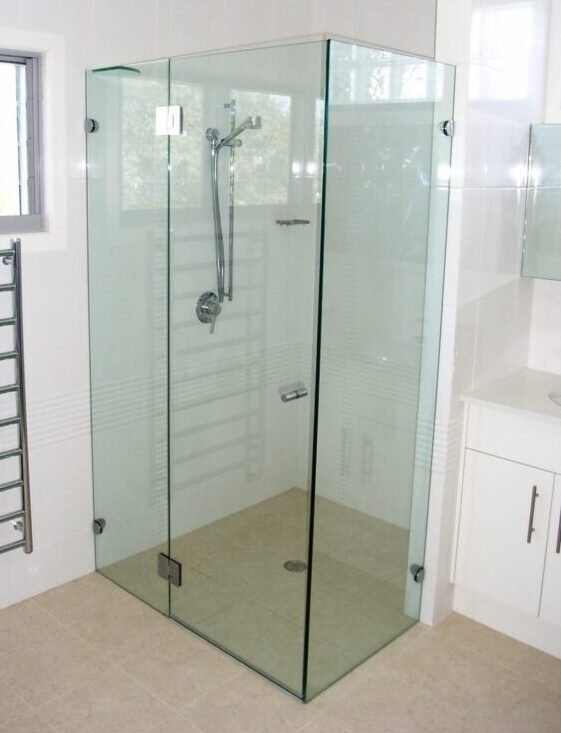 Custom 90-degree frameless shower screen installed in Coffs Harbour bathroom