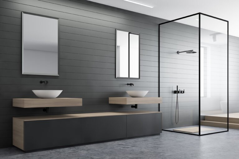 Gray bathroom corner, sink and shower
